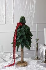 Choinka z żywego nobilisa na pniu – Studio Deluxe